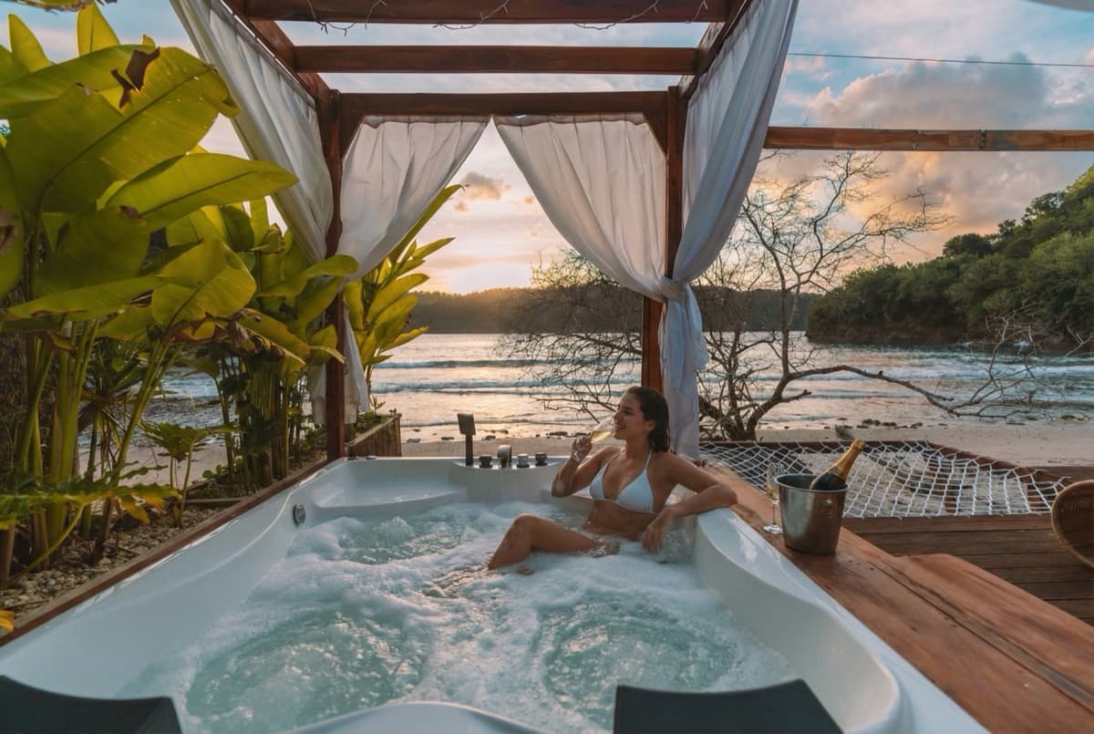Geodesic dome villa at Gamat Bay Resort illuminated at twilight with ocean views on Nusa Penida