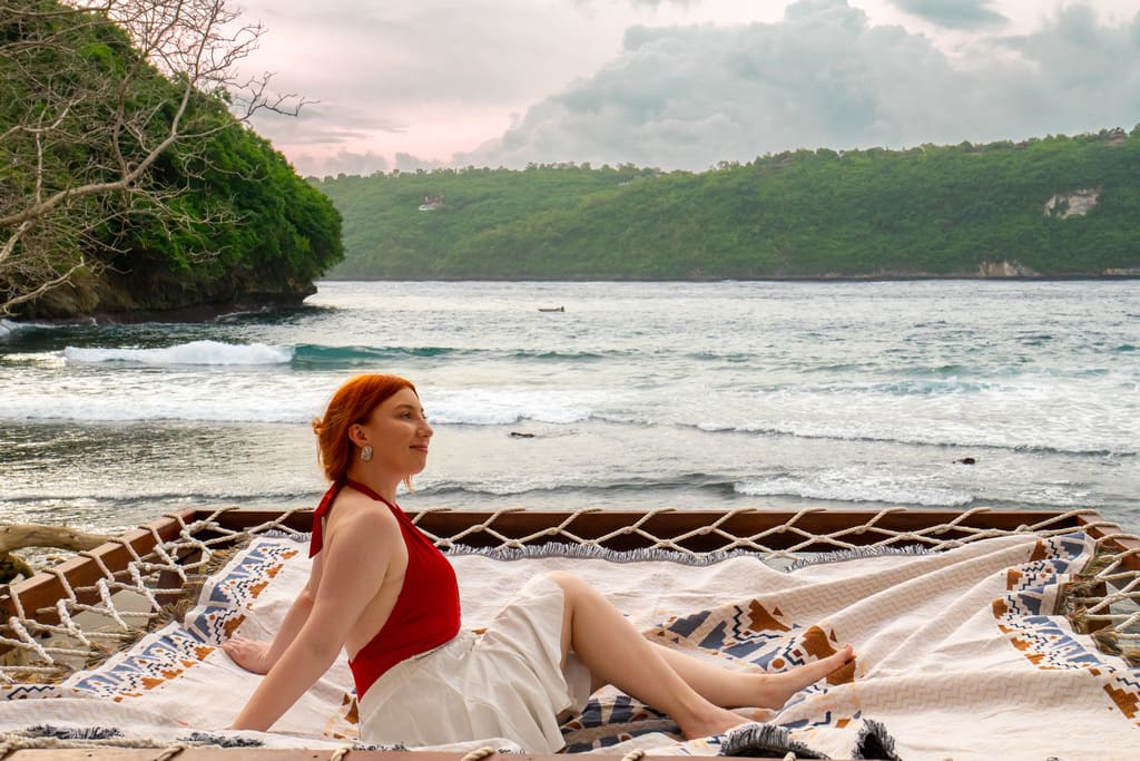 Relaxing on the overwater net at Gamat Bay Resort